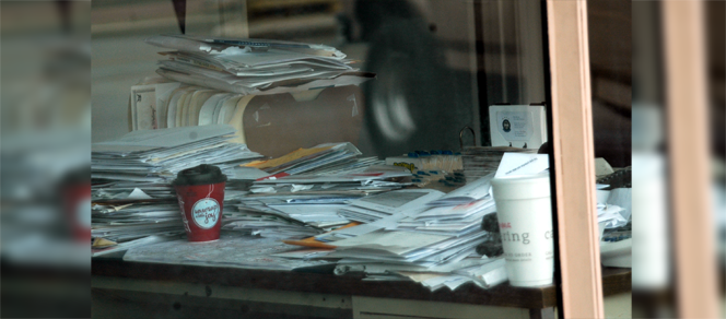 Hiring Manager's Desk Full of Résumés